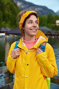 cheerful-european-female-tourist-travels-in-mountains-poses-near-lake-enjoys-sunny-warm-day-wears.jpg